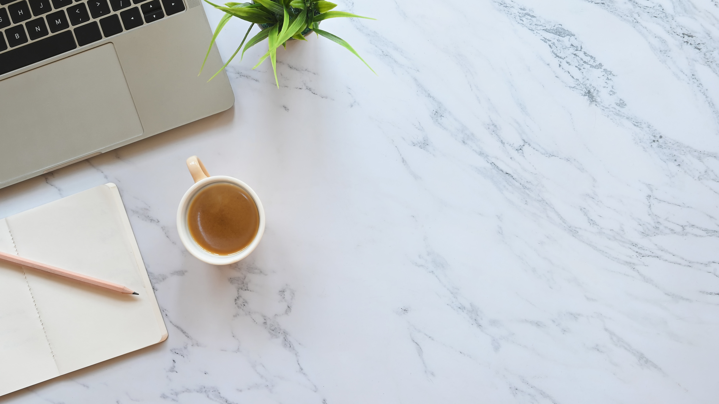 Coffee, Notebook and Laptop on Marble Desk Background